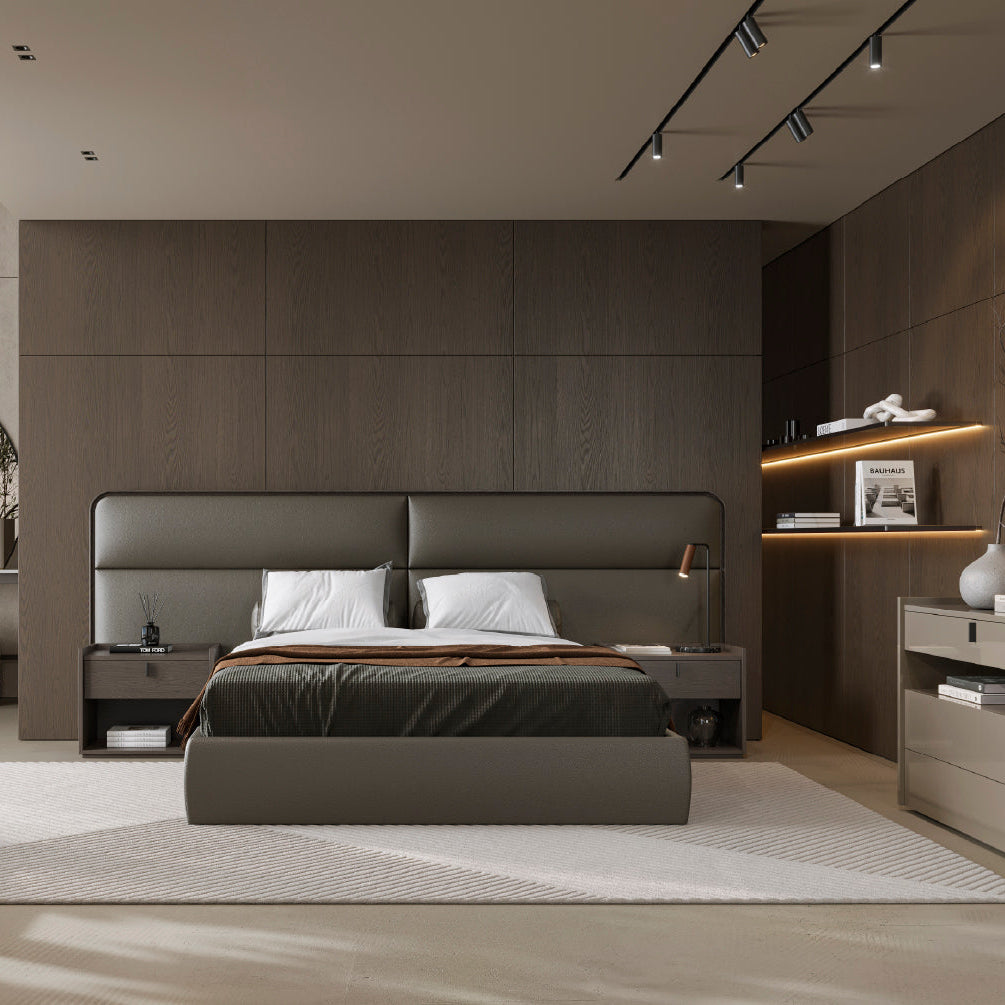 Modern bedroom with a large bed, side tables, and decorative elements.